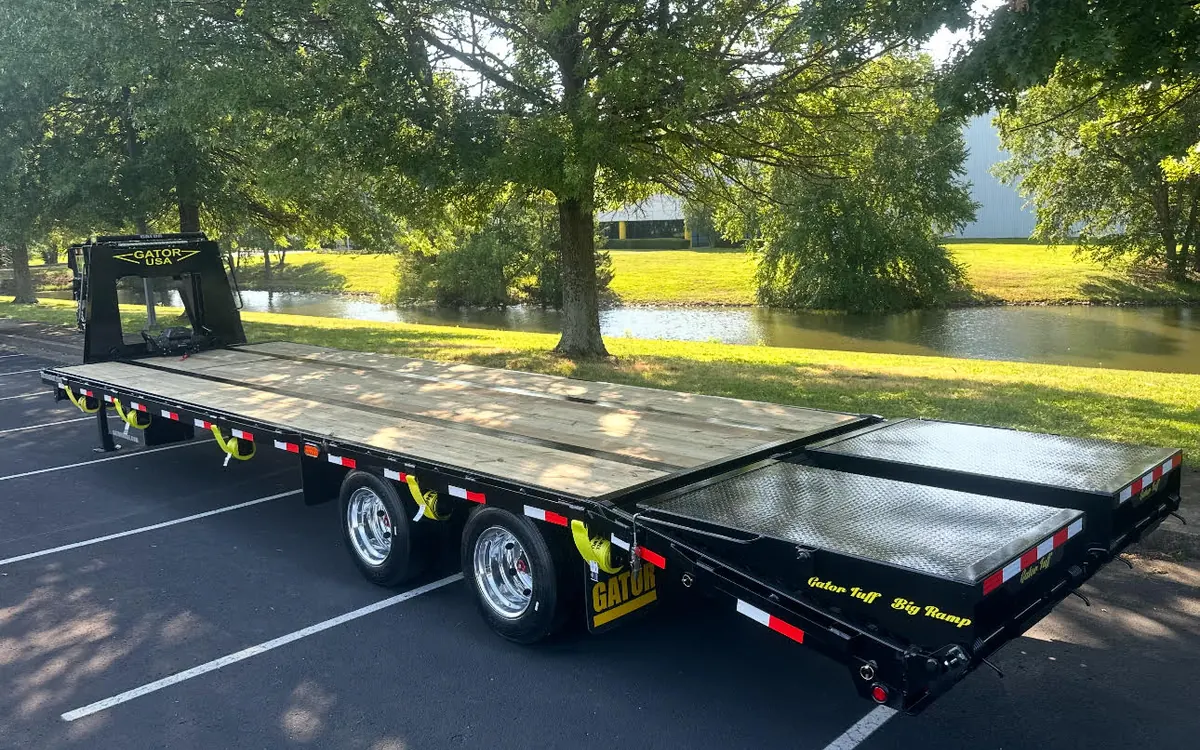 Heavy-duty Gatormade deckover gooseneck trailer showing the full-length steel I-beam frame